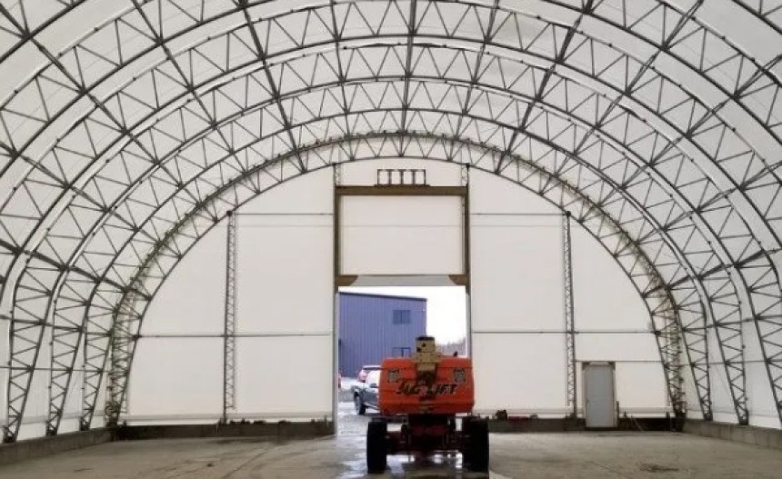 City building tarped storage for salt and sand