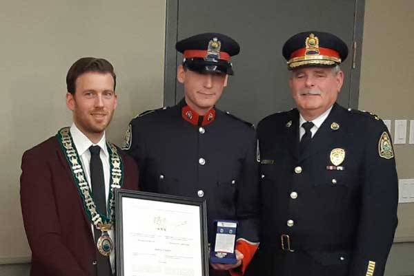 Vickers receives medal for bravery.